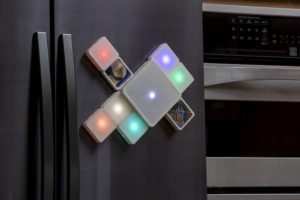 Tangible User interface product EIDOS. Tiles with lights on fridge